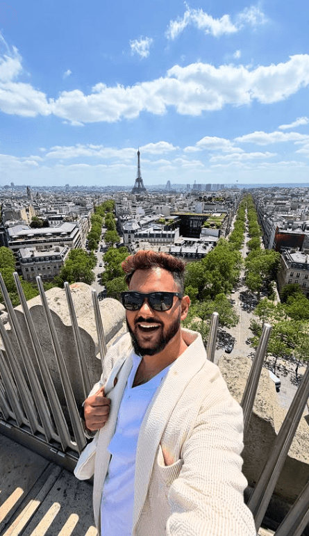 Traveler enjoying scenic skyline and Eiffel Tower city view