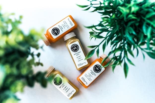 Cold pressed wellness juice bottles flatlay